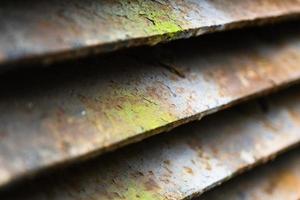 Close-up of rusty metal lattice wall