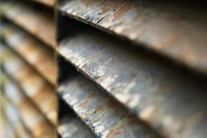 Close-up of rusty metal lattice wall photo