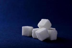 Close-up of Sugar Cubes on Blue Background
