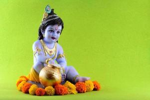 Hindu God Krishna on green background photo