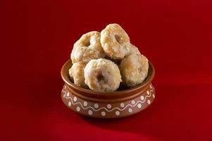 Indian Traditional Sweet Food Balushahi on a red background photo