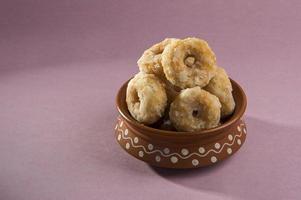 Indian Traditional Sweet Food Balushahi on a pink background photo