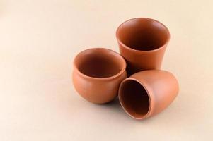 Close-up of Clay pots on cream color background photo