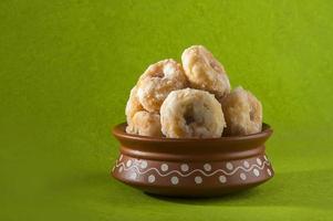 Indian Traditional Sweet Food Balushahi on a green background photo