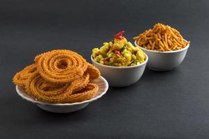 Indian Snack Chakli, chakali or Murukku and Besan Gram flour Sev and chivada or chiwada. Diwali Food photo