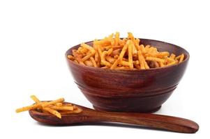 Deep fried salty dish - chivda or mixture made of gram flour and mixed with dry fruits. photo