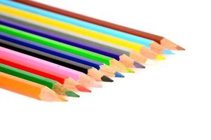 Colour pencils isolated on white background close up photo