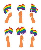 seis estilos de manos sostienen una bandera arcoíris para la actividad lgbt. vector