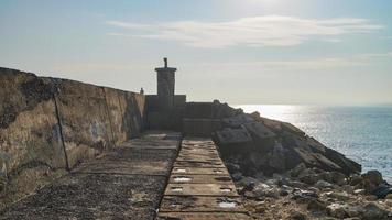 faro del mar de la mañana foto