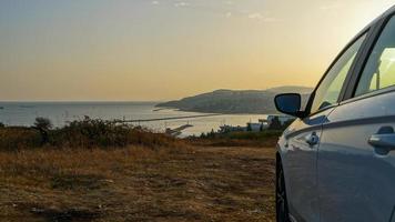 Car meeting the sunrise photo