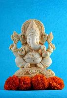 Hindu God Ganesha. Ganesha Idol on blue background photo