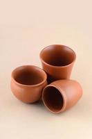 Close-up of Clay pots on cream color background photo