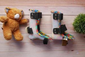 Child cerebral palsy disability shoes on table photo