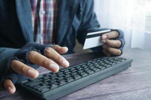 hacker hand stealing data from credit card photo