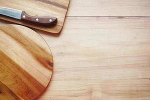 wooden chopping board on table top down photo