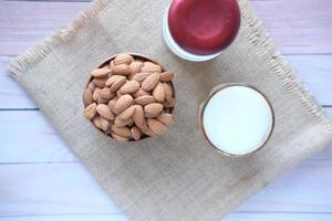 almond nut and milk on table photo