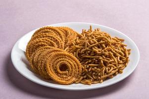 Indian Snack Besan Gram flour Sev and chakli, chakali or Murukku. photo