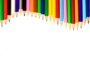 Colour pencils isolated on white background close up photo