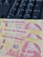 Economy and finance with mexican money photo