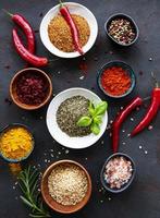 Various spices on a black background photo