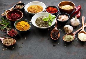 Various spices on a black background photo