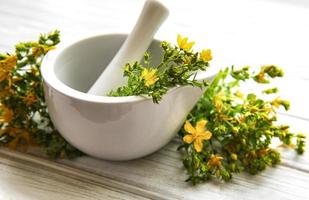 St. John's wort flowers in mortar photo