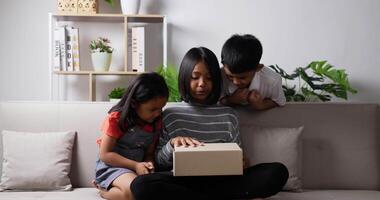 Three kids opening gift box video