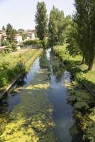 Small river that passes outside the town of Bevagna photo