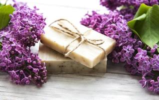 Natural soap and lilac flowers photo