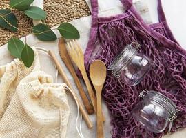 Mesh bag, cotton bags and glass jars photo