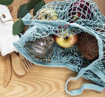 Mesh bag with fruits photo