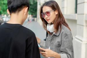 Asian tourist woman is asking for directions photo