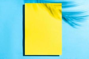Summer background with blank yellow paper photo