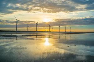 Sillouette of Wind turbine array at Gaomei Wetland, Taiwan photo