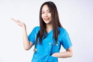 Portrait of an Asian nurse on a white background photo