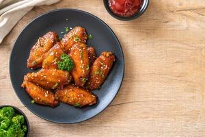 Baked barbecue chicken wings with white sesame photo