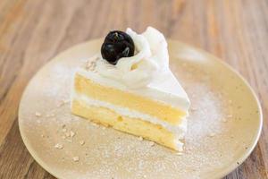 Coconut cake on plate in cafe and restaurant photo