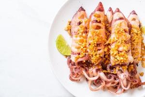 Fried squid with garlic - seafood style photo