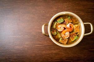Sour soup made of Tamarind Paste with Shrimps and Vegetable Omelet photo