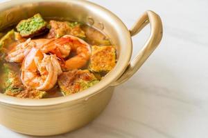 Sour soup made of Tamarind Paste with Shrimps and Vegetable Omelet photo