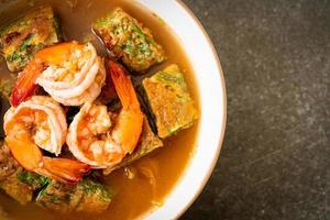 Sour soup made of Tamarind Paste with Shrimps and Vegetable Omelet photo