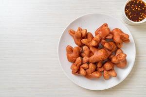 Deep-fried sausage with dipping sauce photo