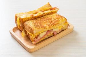 Homemade French toast with ham, bacon, and cheese sandwich with egg photo