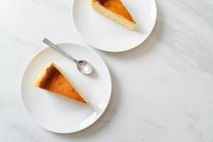 Homemade burn cheesecake on a white plate