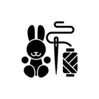 Handmade toys black glyph icon. Amigurumi bunny. Handcrafted pieces for children and toddlers. Plush rabbit. Toy from recycled materials. Silhouette symbol on white space. Vector isolated illustration