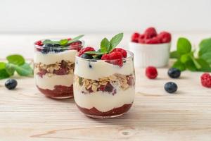 Homemade raspberry and blueberry with yogurt and granola - healthy food style photo