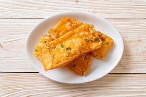 Crispy roti with sugar on plate photo