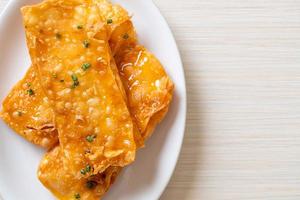 Crispy roti with sugar on plate photo