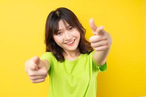 Young Asian girl with expressions and gestures on background