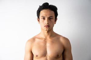Portrait of handsome young man with clean muscles and skin photo